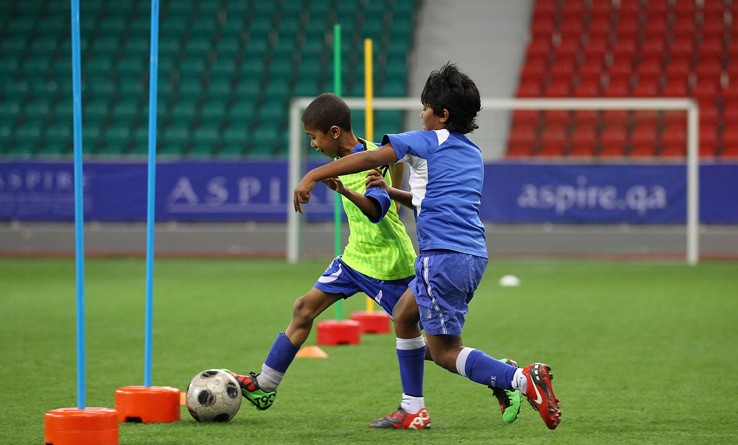 DOHA, QATAR - JANUARY 25:  Local children participate in a football training session at the ASPIRE Academy for Sports Excellence on January 25, 2011 in Doha, Qatar.  (Photo by Robert Cianflone/Getty Images)