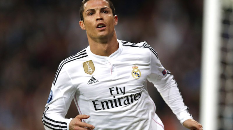 Real Madrid's Cristiano Ronaldo celebrates scoring 2-2 during a Champions League soccer match round of 16 second leg, between Real Madrid and Schalke 04 at Santiago Bernabeu stadium, in Madrid, Spain, Tuesday, March 10, 2015. (AP Photo/Daniel Ochoa de Olza)