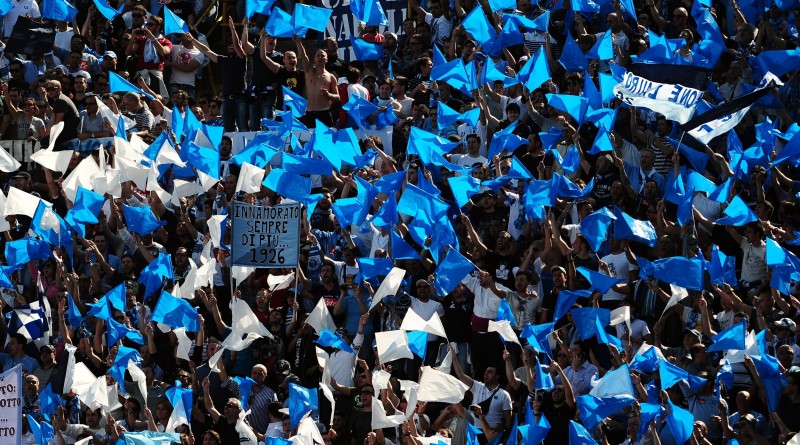 SSC Napoli's supporters cheer their team during their Serie A football match against FC Bologna at Dall'Ara stadium in Bologna on April 10, 2011.  AFP PHOTO / TIZIANA FABI (Photo credit should read TIZIANA FABI/AFP/Getty Images)