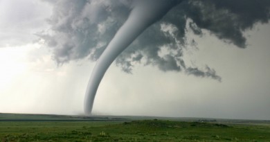 Tornado column in rural landscape